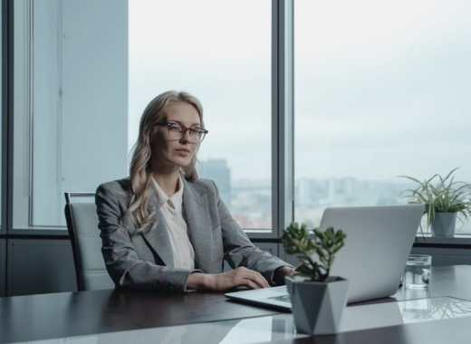 Female CFO Sitting at Her Desk